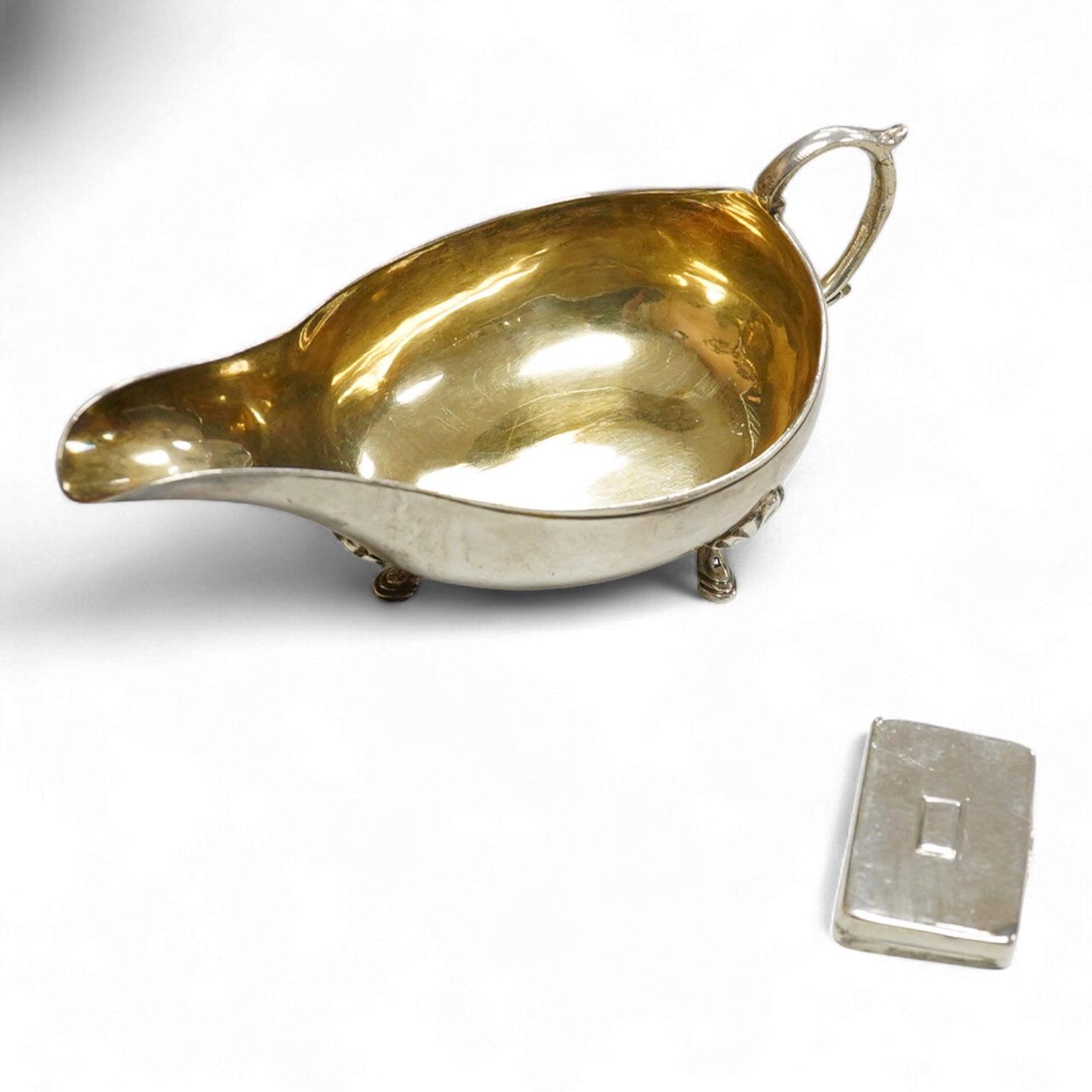 A William IV silver rectangular vinaigrette, by Nathaniel Mills, Birmingham 1830, 30mm(tired), together with a William IV silver pap boat, London, 1832, with later added hallmarked Victorian handle.